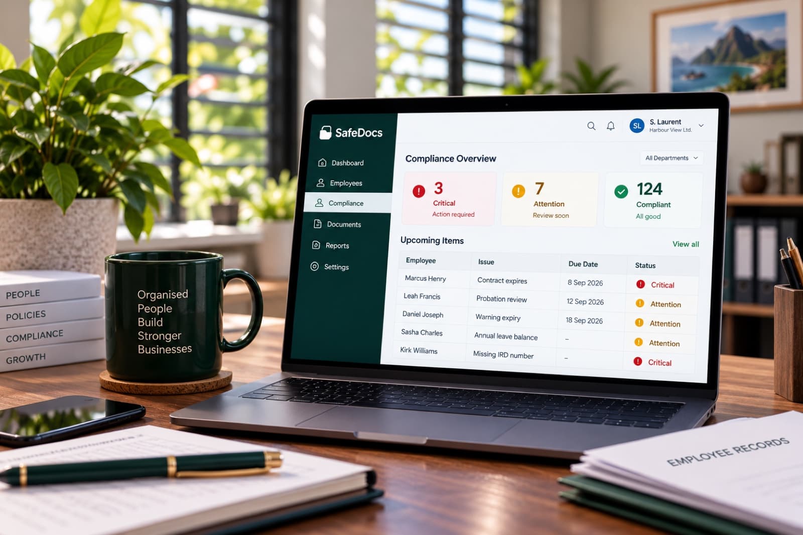 The SafeDocs Compliance Overview screen showing critical, attention and compliant counts and an upcoming items table, open on a laptop
