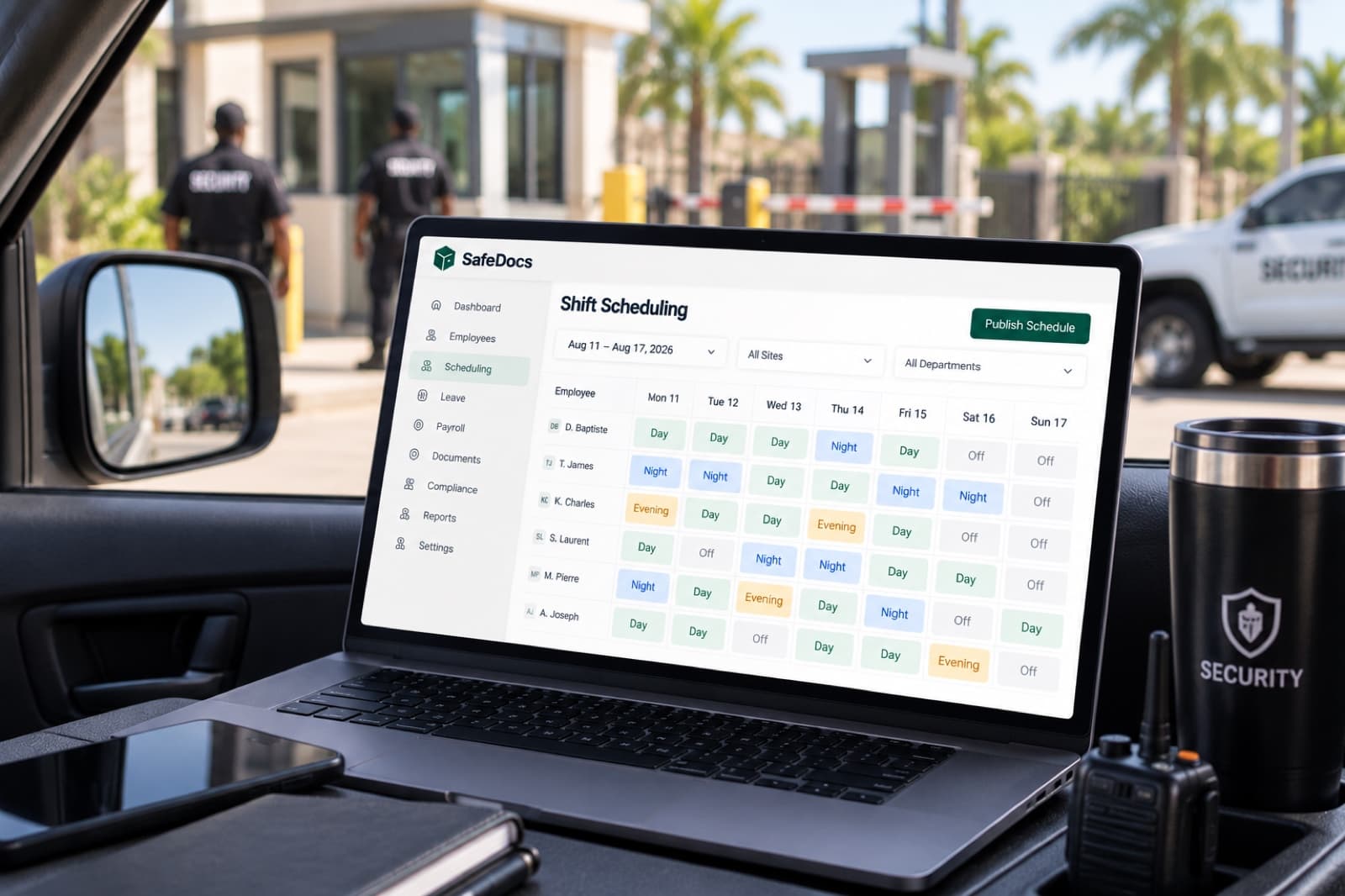 The SafeDocs Shift Scheduling screen showing a week of shifts across a security team, open on a laptop in a patrol vehicle